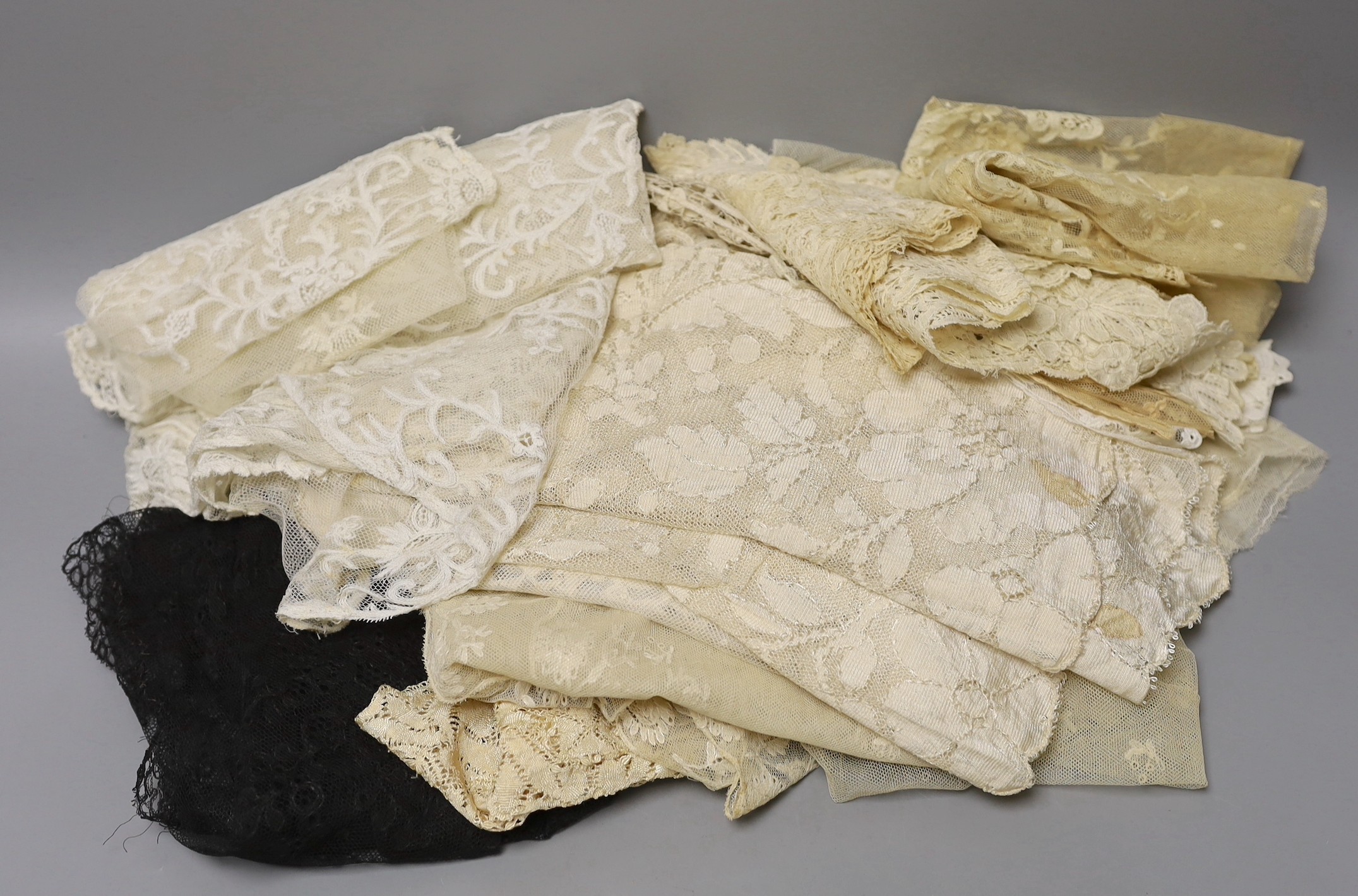 A collection of 19th century hand made Honiton bobbin lace collars, trim etc and various needle run bonnet veils, a Maltese silk lace panel together with other lace.